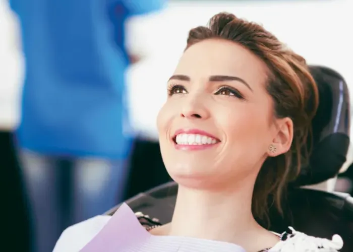 A Woman Smiling Facing her Dentist
