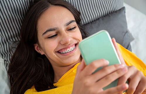 A Girl Reading Reviews on Phone