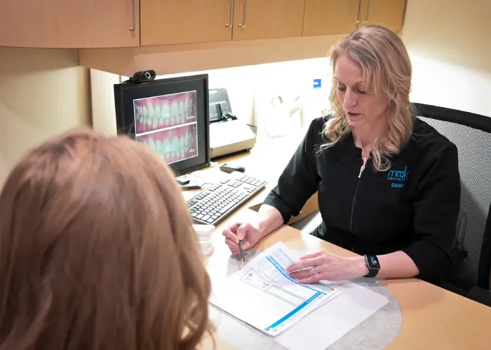 A Dentist Explaining her Patient