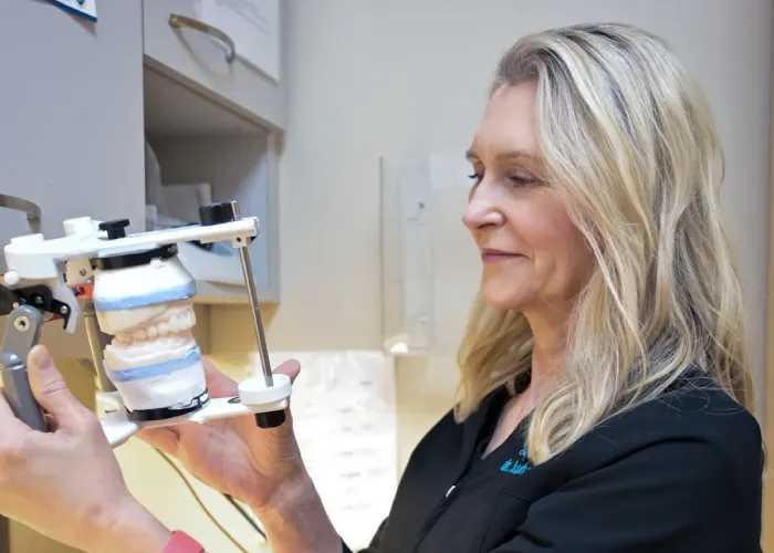 A Dentist Check-up her Patient